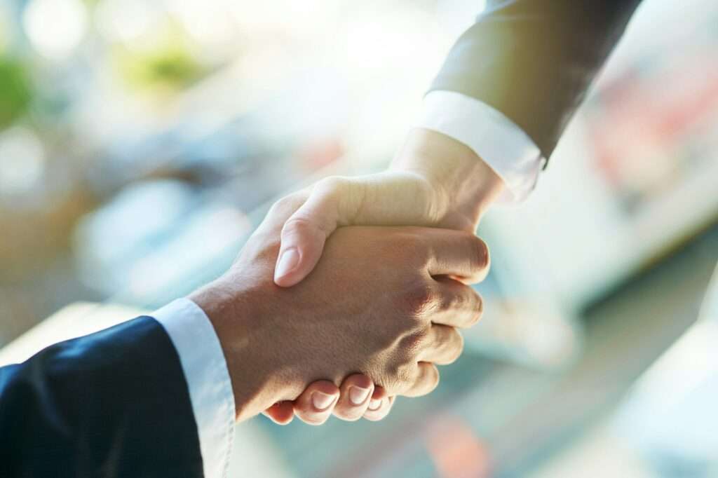 Building business links. Shot of two businesspeople shaking hands.