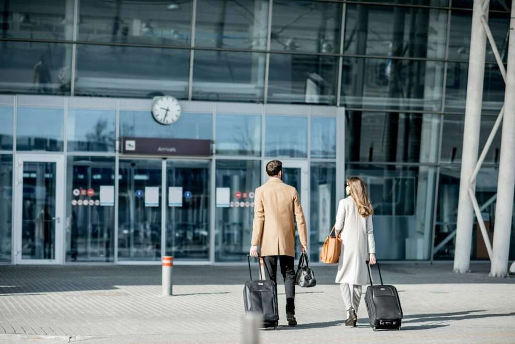 Business couple walking to the airport