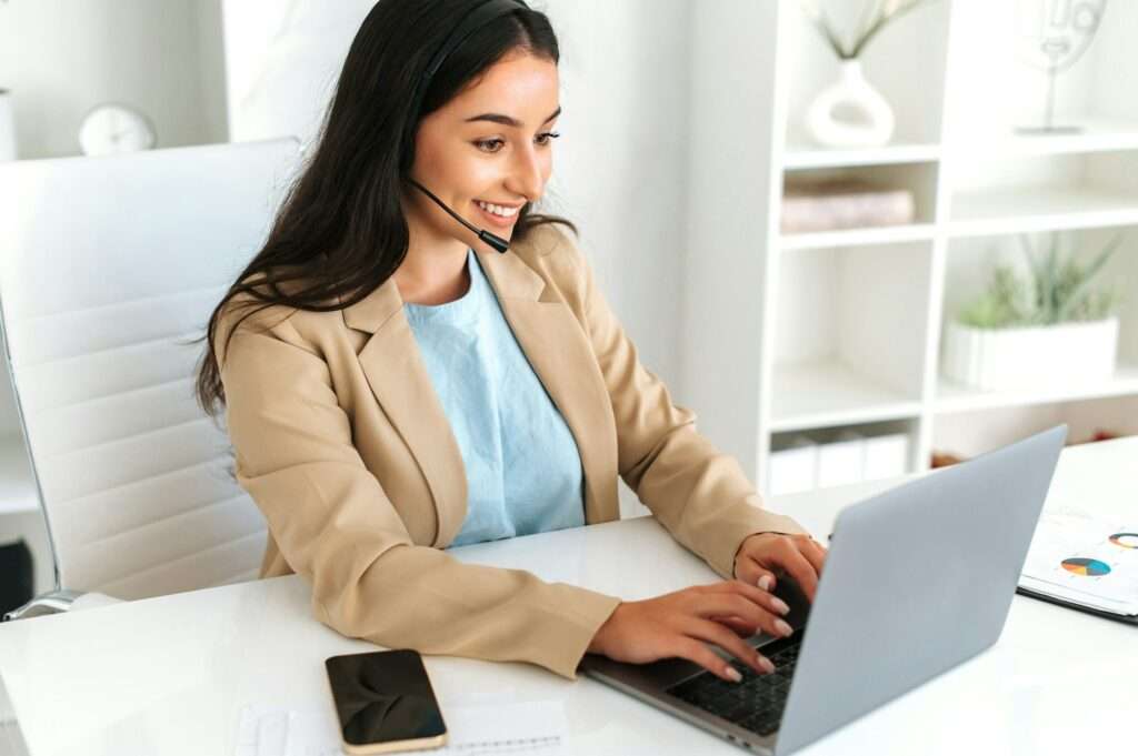 Call center, customer support service. Friendly positive woman, call center operator with headset