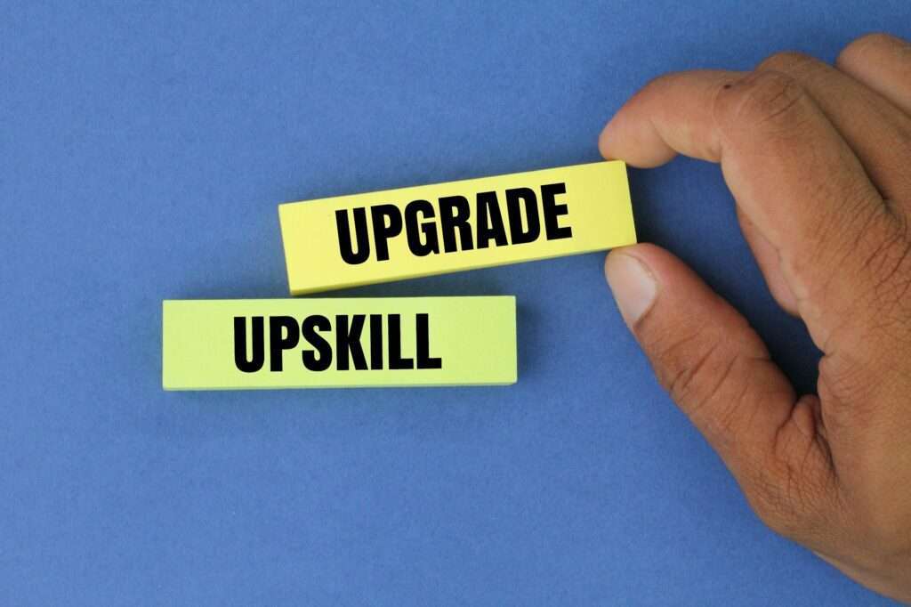 colored paper with the words upgrade and upskill.