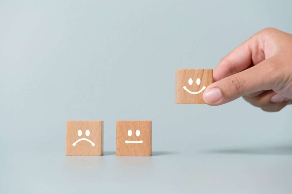 Concept of customer satisfaction review. Customer choose best rank with smiling face.