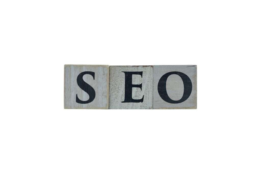 Wooden cubes showing the letters SEO (Search Engine Optimization) on white background