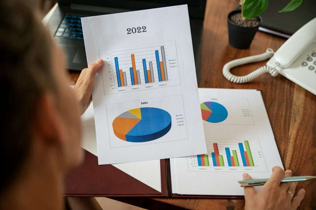 Businesswoman reading and examining a statistical business report