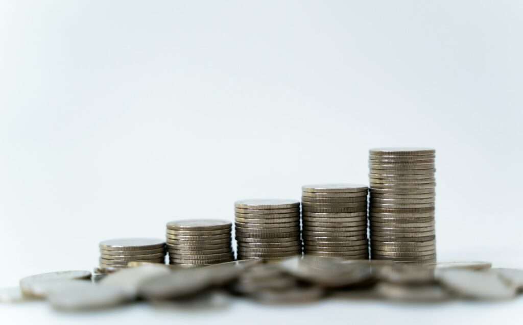 Coin stack with white background, Concept of money saving and growing business.