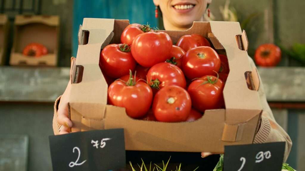 Female vendor stand holder at local marketplace