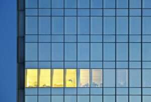 Lonely Illuminated Room In An Office Tower