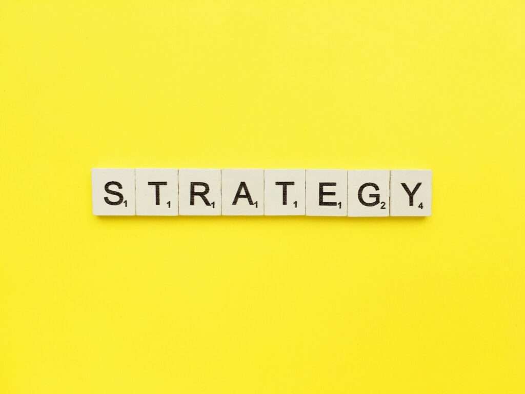 Strategy scrabble letters word on a yellow background