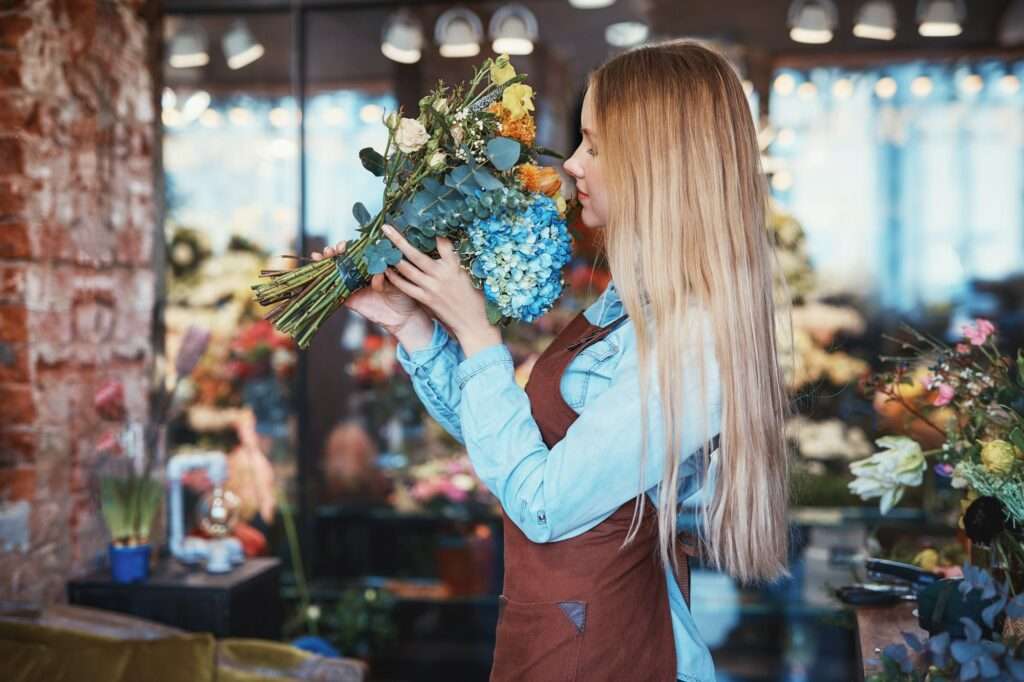 Working girl in uniform with flowers