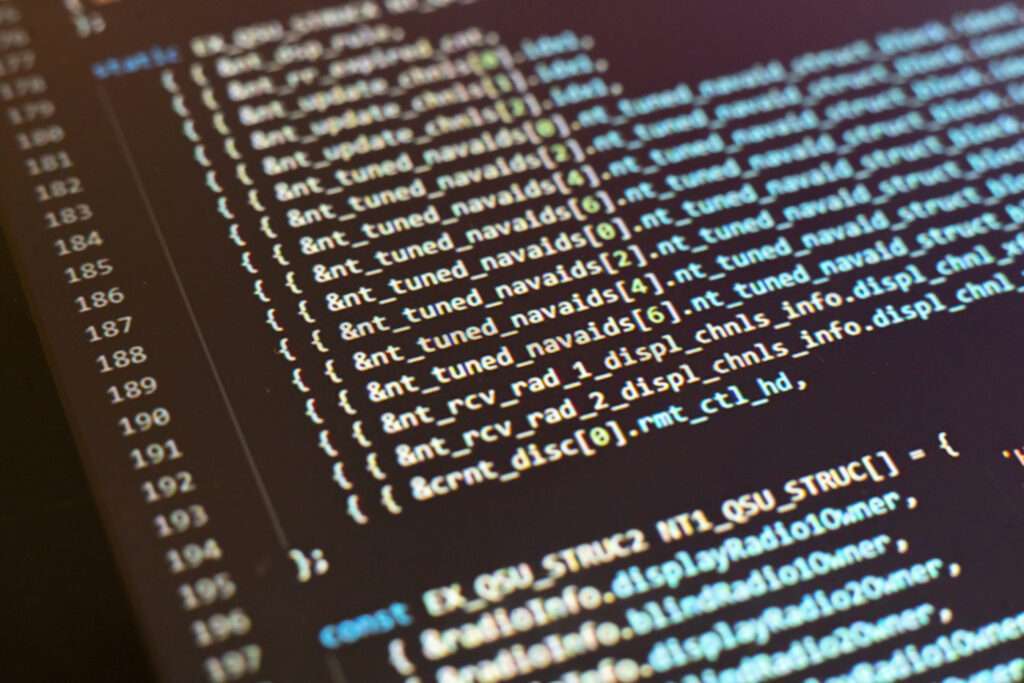 Webdesign Hannover - Nahaufnahme eines Computerbildschirms, auf dem PHP-Codezeilen angezeigt werden, leicht erklärt. Der Code enthält verschiedene Funktionen und Variablen, wobei die Syntax in leuchtenden Farben hervorgehoben wird. Einige Abschnitte sind in Klammern eingeschlossen, um die Programmierlogik und -struktur anzuzeigen. Local SEO Agentur Hannover.